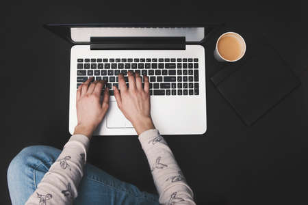 girl working from home - black backgroundの写真素材
