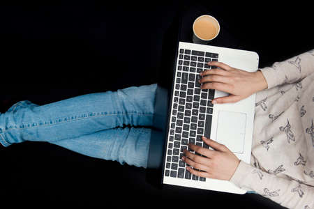 girl working from home - black backgroundの写真素材