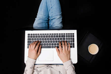 girl working from home - black backgroundの写真素材
