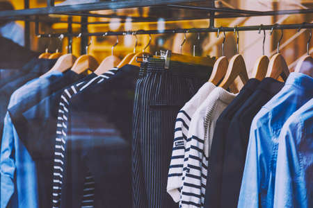 clothes on a rack in a storeの写真素材