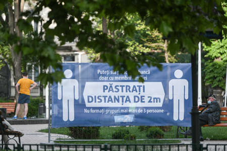 Bucharest, Romania - 16 May 2020: People in a Park on the second day of relaxation of the measures taken by the authorities against the COVID-19 pandemic, in Bucharest.のeditorial素材