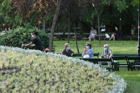 Bucharest, Romania - 16 May 2020: People in Cismigiu Park on the second day of relaxation of the measures taken by the authorities against the COVID-19 pandemic, in Bucharest.のeditorial素材