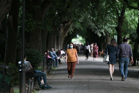 Bucharest, Romania - 16 May 2020: People in Cismigiu Park on the second day of relaxation of the measures taken by the authorities against the COVID-19 pandemic, in Bucharest.のeditorial素材