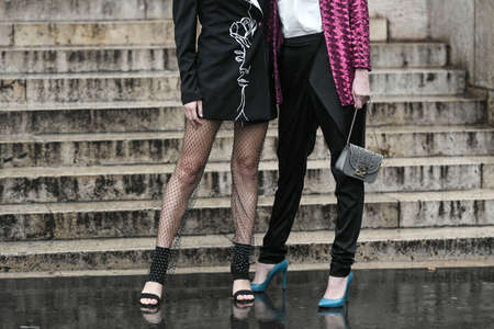 Paris, France  March 2, 2020: Women wearing fishnet tights with diamond details and black high waisted trousers - streetstylefw20のeditorial素材