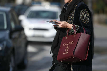 Paris, France â March 3, 2020: Burgundy leather Chanel handbag - streetstylefw20のeditorial素材