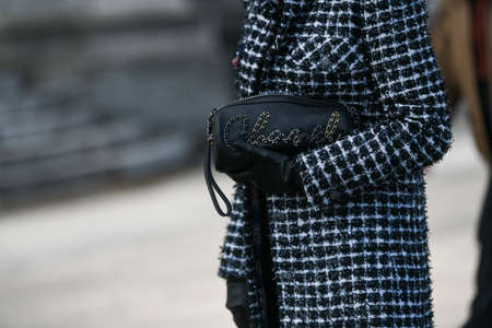 Paris, France â March 3, 2020: Black leather Chanel bag with chain logo detail - streetstylefw20のeditorial素材
