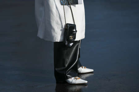 Paris, France â March 3, 2020: Black patent leather Chanel mini chain bag - streetstylefw20のeditorial素材