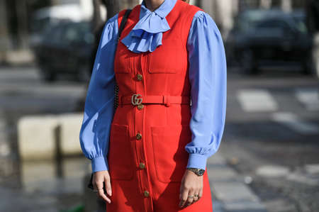 Paris, France â March 3, 2020: Red Gucci dress with logo belt matched with a blue ruffled shirt - streetstylefw20のeditorial素材