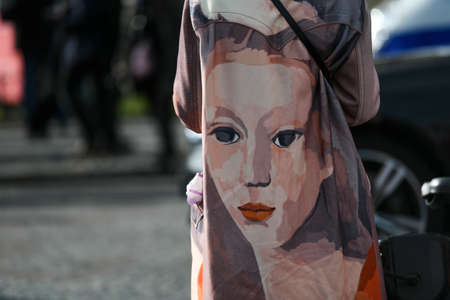 Paris, France â March 3, 2020: Coat with a huge woman portrait on the back side detail - streetstylefw20のeditorial素材