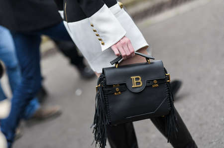 Paris, France - February 28, 2020: Black leather Balmain handbag with fringe - streetstylefw20のeditorial素材