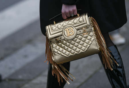 Paris, France - February 28, 2020: Golden Balmain quilted leather bag with fringe - streetstylefw20のeditorial素材