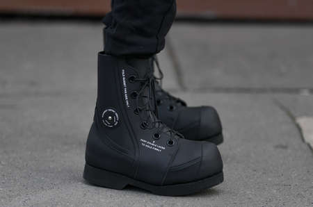 Paris, France - February 29, 2020: Black boots detail - streetstylefw20のeditorial素材