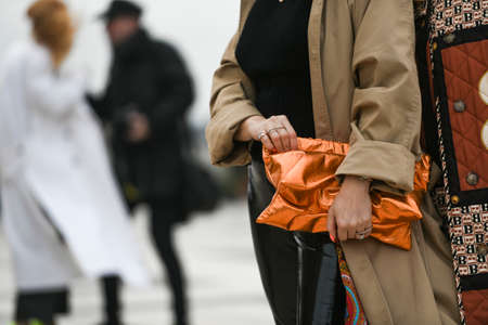 Paris, France - February 29, 2020: Neon orange clutch bag - streetstylefw20のeditorial素材