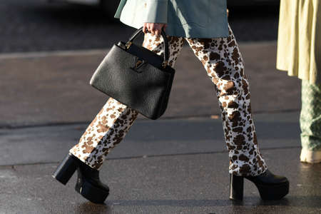 Paris, France - February 26, 2020: Black leather Louis Vuitton bag - streetstylefw20のeditorial素材