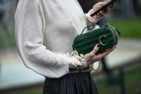 Paris, France - February 27, 2020: Dark green patterned chain bag - streetstylefw20のeditorial素材