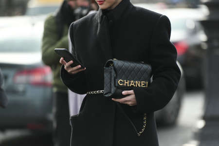 Paris, France â March 3, 2020: Woman wearing a Chanel black leather bag - streetstylefw20のeditorial素材