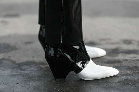 Paris, France â March 3, 2020: Black and white Chanel high heel boots- streetstylefw20のeditorial素材