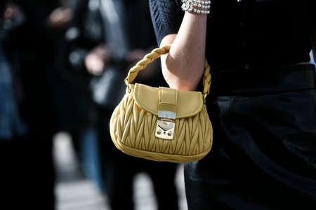 Paris, France â March 3, 2020: Yellow leather Miu Miu handbag - streetstylefw20のeditorial素材