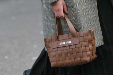 Paris, France â March 3, 2020: Brown leahter Miu Miu woven handbag - streetstylefw20のeditorial素材