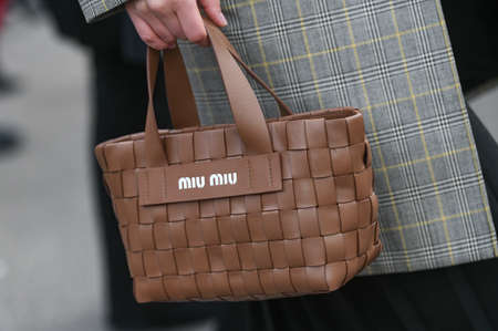Paris, France â March 3, 2020: Brown leahter Miu Miu woven handbag - streetstylefw20のeditorial素材