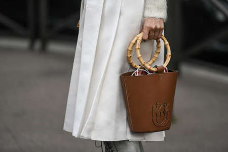 Paris, France â March 3, 2020: Brown leather Miu Miu handbag with bamboo top handle - streetstylefw20のeditorial素材