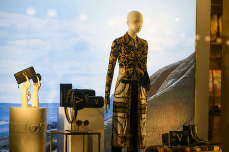 Milan, Italy - January 13, 2020: Versace womenâs outfit, bags, boots, jewlery and sunglasses displayのeditorial素材
