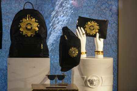 Milan, Italy - January 11, 2020: Black and golden Versace accessories displayed in a showcase