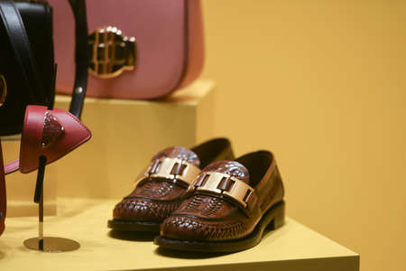 Milan, Italy - January 13, 2020: Prada brown leather shoes display