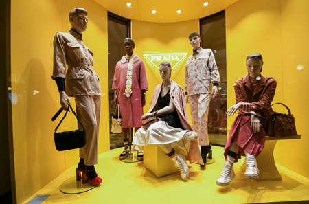 Milan, Italy - January 11, 2020: Prada colorful clothing and accessories showcase at night