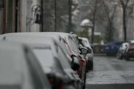 Cars covered in snow after a cold day.の写真素材