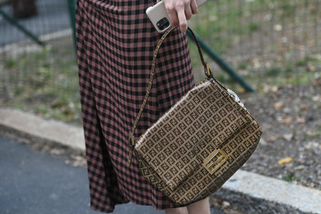 Milan, Italy - September 22, 2021:  Street style outfit, fashionable woman wearingFendi outfit on the streets of Milan, Italy.のeditorial素材