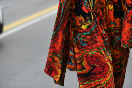 Milan, Italy - September 22, 2021:  Street style outfit, fashionable woman wearing a colorful Fendi...