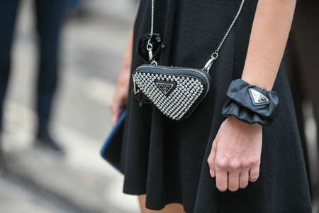 Milan, Italy - September 22, 2021:  Street style outfit, fashionable woman wearingPrada handbag  on...