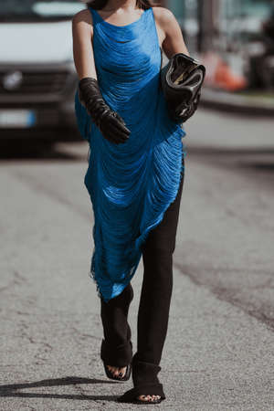Milan, Italy - September 24, 2021:  Street style outfit, woman wearing a fashionable outfit, detail  on the streets of Milan, Italy.のeditorial素材