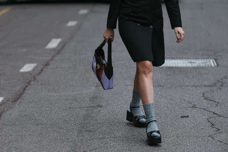 Milan, Italy - September 25, 2021:  Street style outfit, woman wearing a fashionable outfit on the...