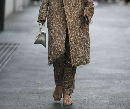 Milan, Italy - September 22, 2021:  Street style outfit, woman wearing a fashionable outfit, detail  on the streets of Milan, Italy.のeditorial素材