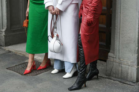 Milan, Italy - September 25, 2021:  Street style outfit, group of three fashionable women on the streets of Milan, Italy.のeditorial素材