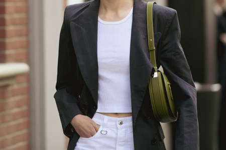 Milan, Italy - September 22, 2021:  Street style outfit, woman wearing a fashionable outfit, detail ...