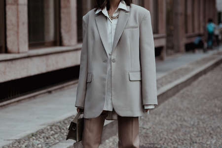 Milan, Italy - September 22, 2021:  Street style outfit, woman wearing a fashionable outfit,  on the...