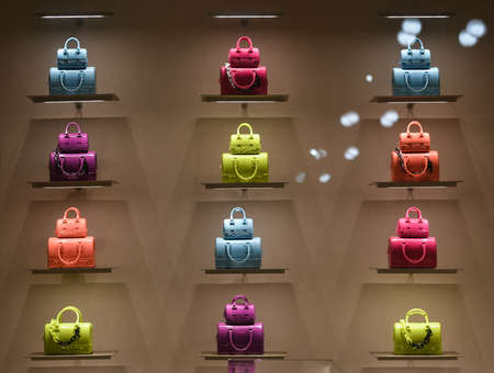 Milan, Italy - September 24, 2021: Chanel luxury and fashionable clothes and accessories from new collection 2022, close up store show caseのeditorial素材