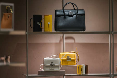 Milan, Italy - September 24, 2021: Chanel luxury and fashionable clothes and accessories from new collection 2022, close up store show caseのeditorial素材