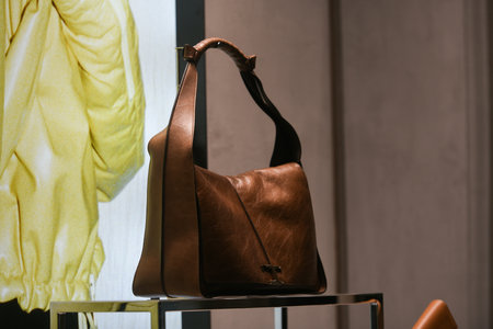 Milan, Italy - September 24, 2021: Balenciaga luxury and fashionable clothes and accessories from new collection 2022, close up store show caseのeditorial素材