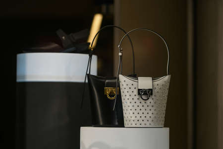 Milan, Italy - September 24, 2021: Miu Miu luxury and fashionable clothes and handbags from new collection 2022, close up store show caseのeditorial素材