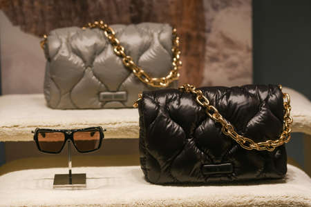 Milan, Italy - September 24, 2021: Miu Miu luxury and fashionable clothes and handbags from new collection 2022, close up store show caseのeditorial素材