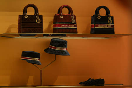 Milan, Italy - September 24, 2021: Miu Miu luxury and fashionable clothes and handbags from new collection 2022, close up store show caseのeditorial素材