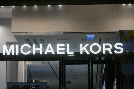 Milan, Italy - September 24, 2021: Michael Kors logo displayed on a facade of a store in Milan.のeditorial素材