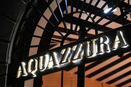 Milan, Italy - September 24, 2021: Aquazzura logo displayed on a facade of a store in Milan.のeditorial素材