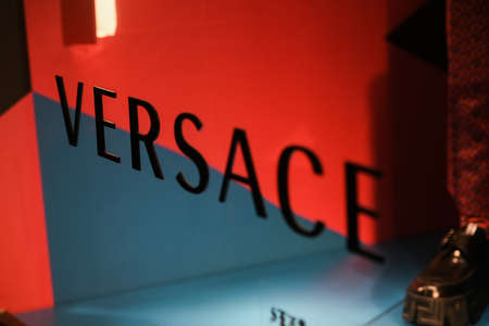 Milan, Italy - September 24, 2021: Versace logo displayed on a facade of a store in Milan.のeditorial素材