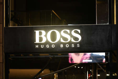 Milan, Italy - September 24, 2021: Hugo Boss logo displayed on a facade of a store in Milan.のeditorial素材