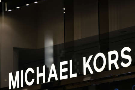 Milan, Italy - September 24, 2021: Michael Kors logo displayed on a facade of a store in Milan.のeditorial素材